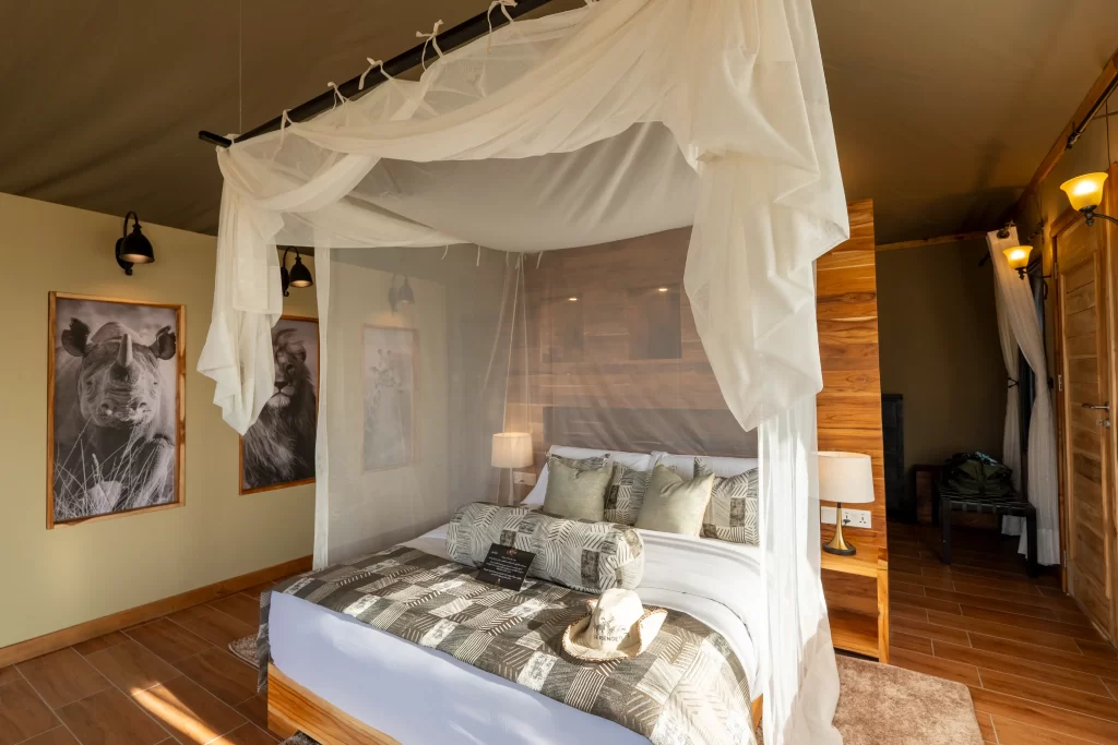inside a double room at river camp by karibu camps